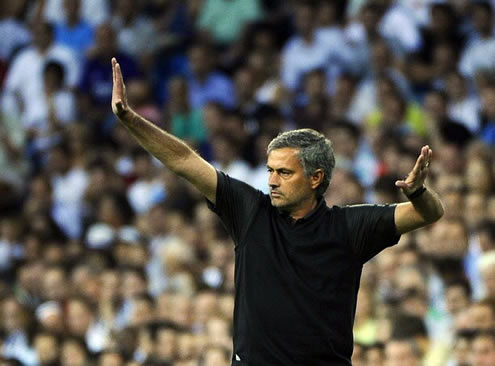 José Mourinho show, gesticulating to his players in a Real Madrid match