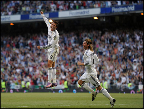 Cristiano Ronaldo and Sergio Ramos celebrate a Real Madrid goal, while the Portuguese gives a big jump