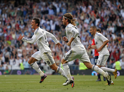 Sergio Ramos chasing Cristiano Ronaldo, who is absolutely delighted for having scored for Real Madrid