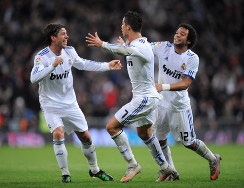 Cristiano Ronaldo looking to hug Sergio Ramos, with Marcelo already pulling him from behind