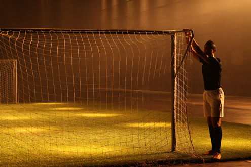 Cristiano Ronaldo holding a soccer goal