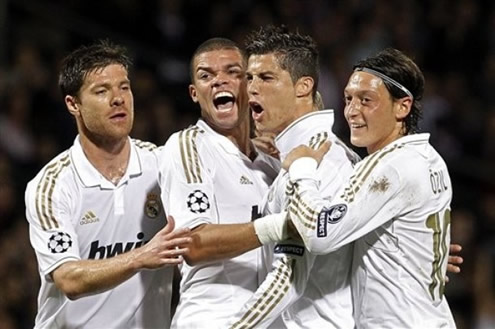Cristiano Ronaldo exults with joy, with his Real Madrid teammates Xabi Alonso, Pepe and Ozil