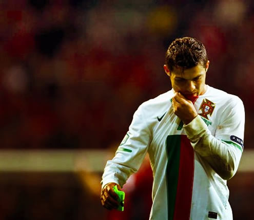 Cristiano Ronaldo kisses the Portuguese National Team jersey and badge