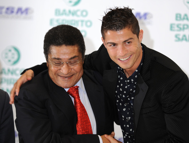 Cristiano Ronaldo taking a photo with Eusébio, Portuguese all-time legend