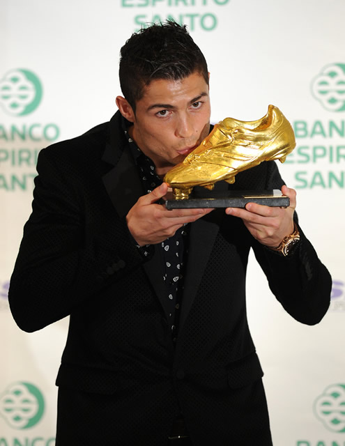 Cristiano Ronaldo looking at the cameras while kissing the 