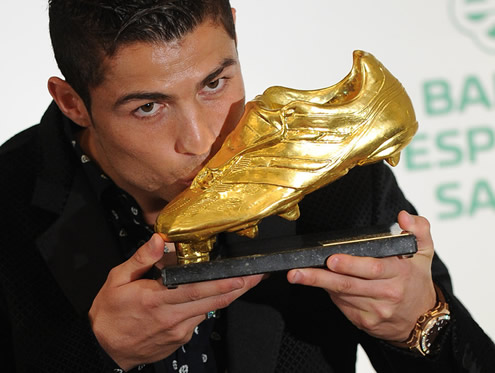 Cristiano Ronaldo photo giving a kiss to European Golden Shoe award 2011