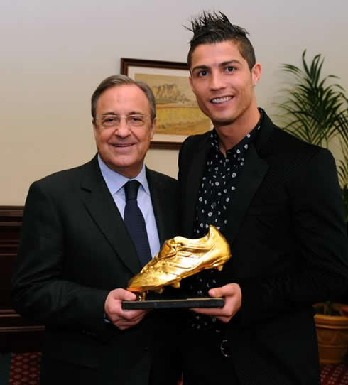 Cristiano Ronaldo and Florentino Pérez holding the Golden Shoe trophy
